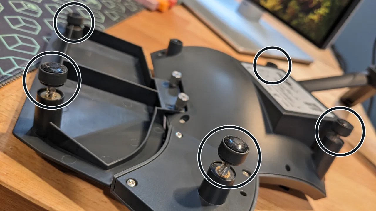 The five adjustable feet on the bottom of each half of the Glove80